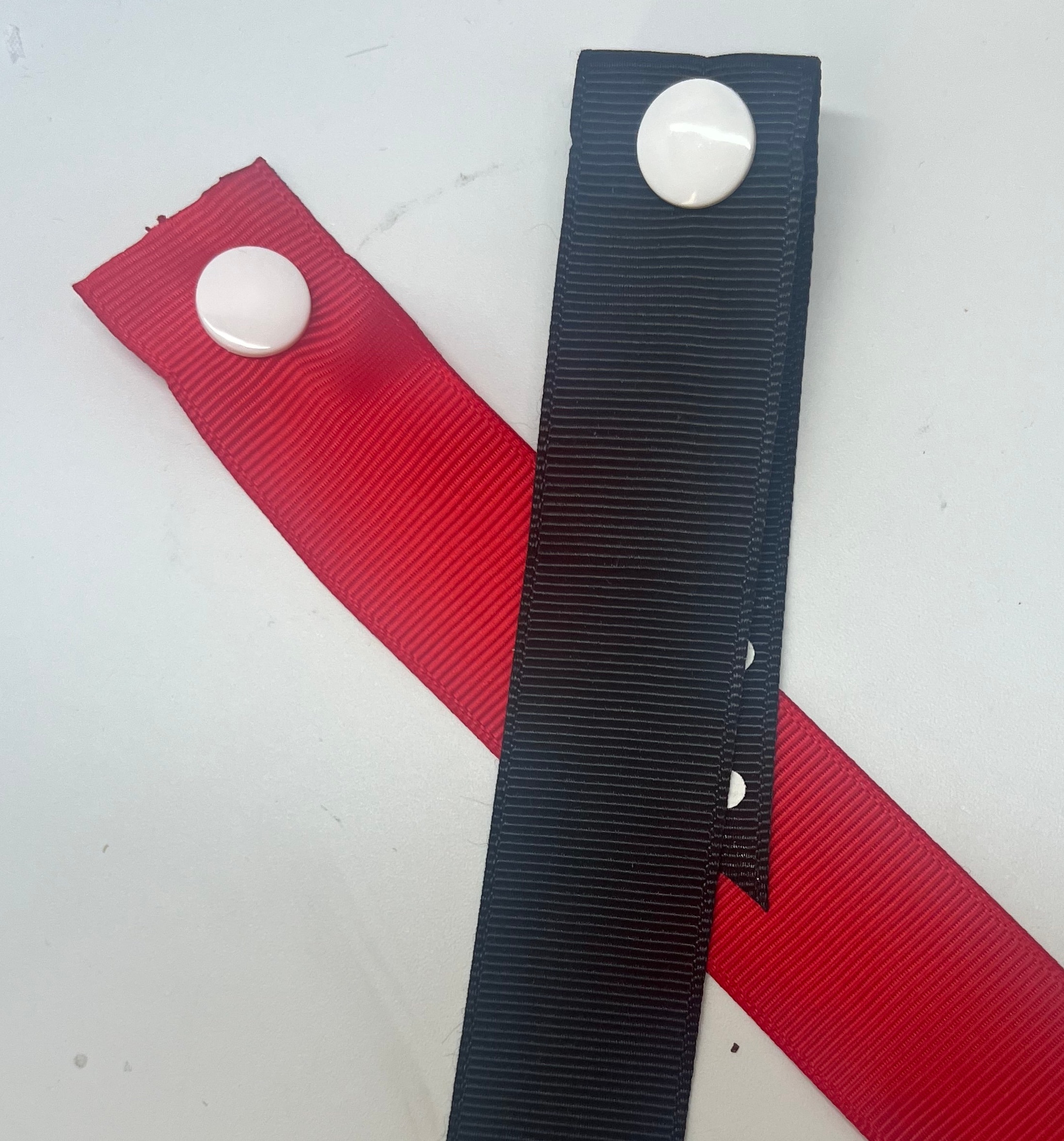 Harvest Homestead snap-on ribbon extensions — solid red and solid black